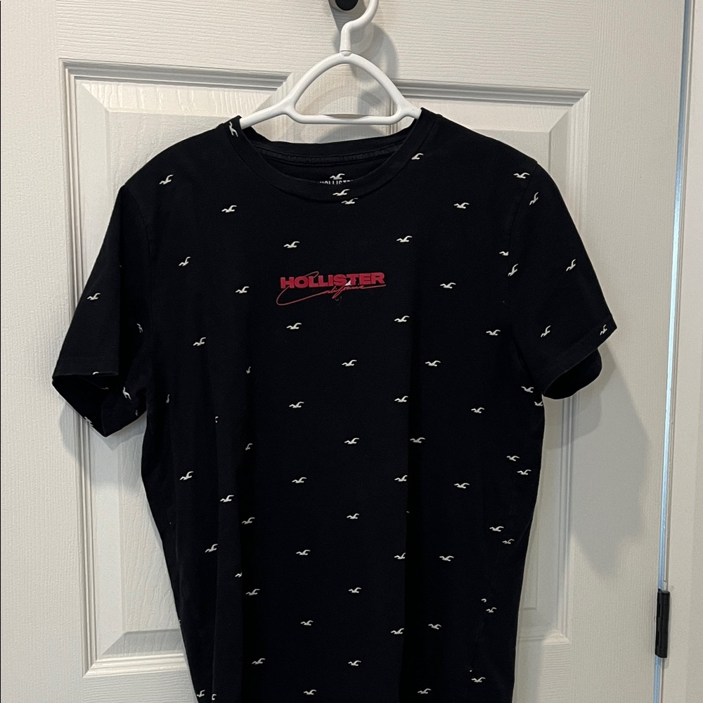 Hollister Black Tee with Red Logo and White Pattern